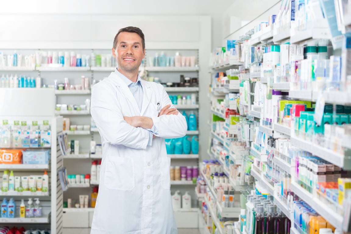 Smiling Pharmacist Standing Arms Crossed 